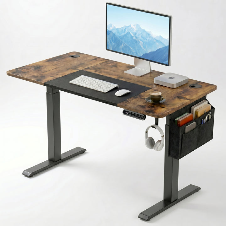 [110cm x 60cm] Rustic Electric Standing Desk with dark wood top and black frame, monitor, desk mat, side organiser, and headphone hook