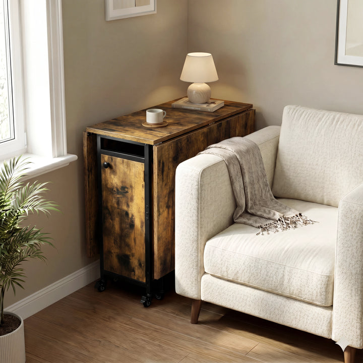 [Rustic] Kitchen & Dining Furniture Sets folded table parked beside a sofa with lamp, cup, blanket, and window light.