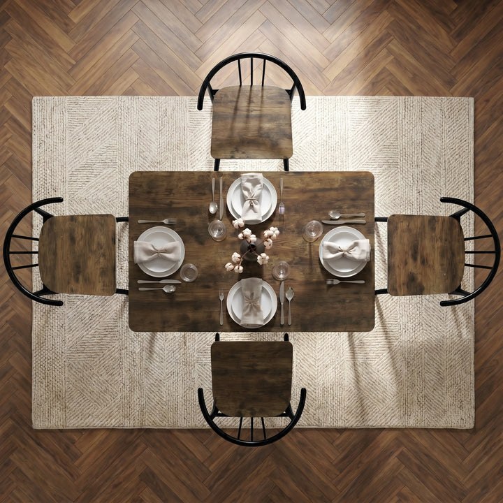 [Rustic] Torvi 4 seater dining set bird's-eye view fully laid with plates, cutlery, glasses and napkins on a textured rug over dark wooden floor