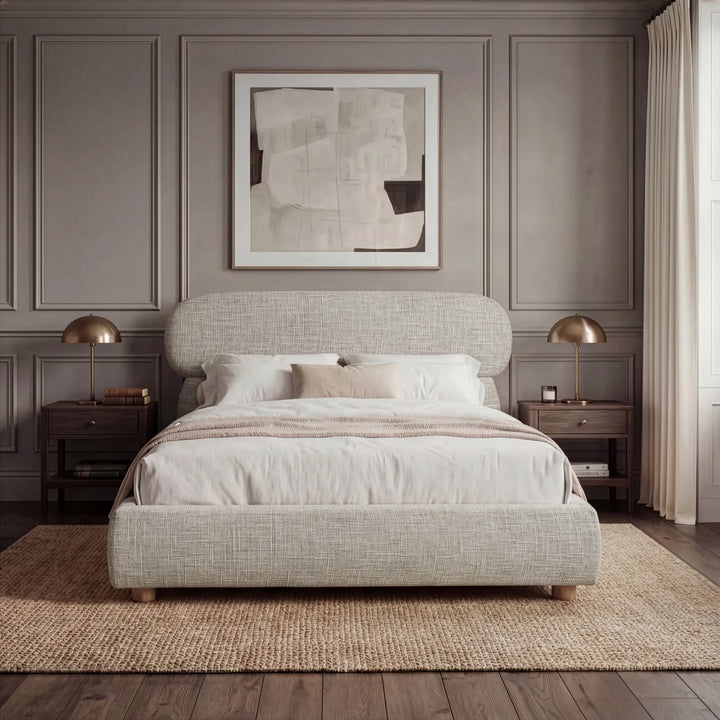[Double | Camel] Front view of upholstered bed with pill-shaped headboard centred between matching nightstands with lamps