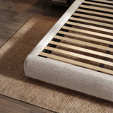 [Double | Camel] Bed frame base detail with wooden slats and woven fabric corner on herringbone floor
