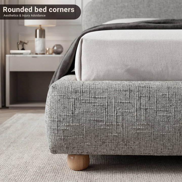 [Double | Grey] Bed frame foot-end corner showing soft rounded edges and throw draped above