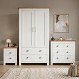 [White] Shaker white 2 door wardrobe, 2 over 2 drawer chest and 2 drawer bedside grouped on shaggy rug with oak tops