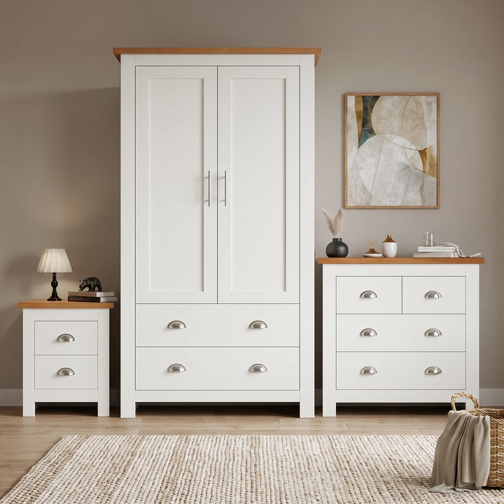[White] Shaker white 2 door wardrobe, 2 over 2 drawer chest and 2 drawer bedside grouped on shaggy rug with oak tops