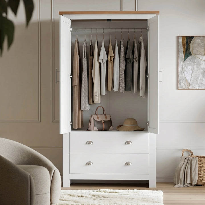 [White] Open view of white Shaker wardrobe with hanging rail across full width and lower drawer storage