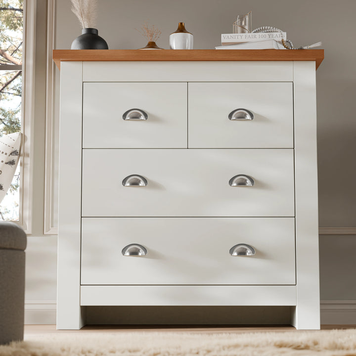 [White] Shaker chest of drawers in white with decor cluster on the oak top and panelled wall behind