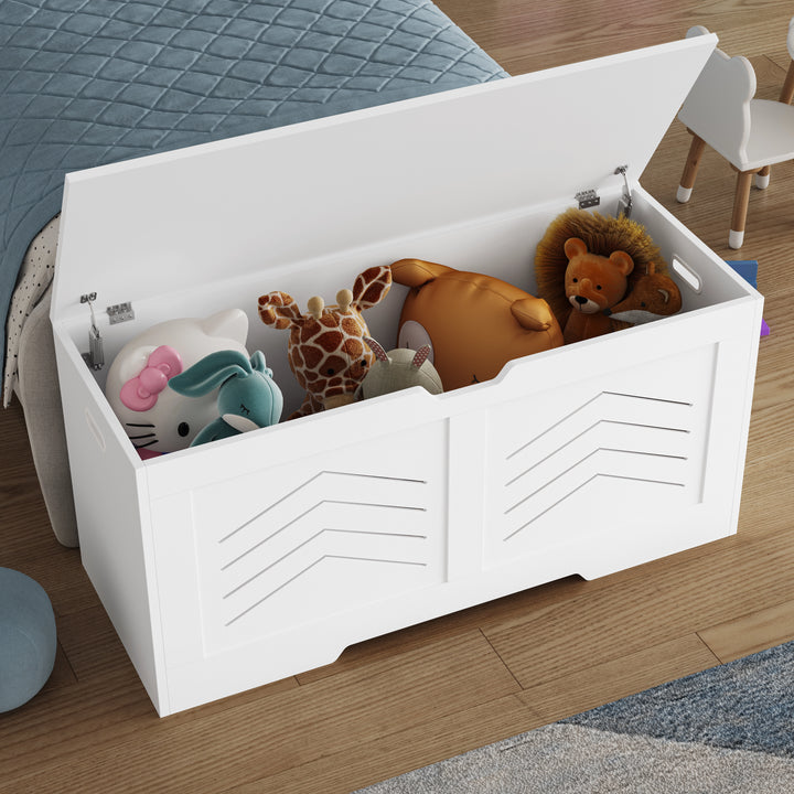 [White] Open white shaker toy box on wooden floor revealing plush toys packed into the storage space
