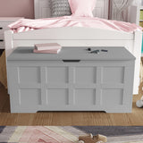 [Grey] Closed grey toy storage chest with grid panel front and central cutout handle in child's room