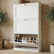 [White] White shaker shoe cabinet in hallway with slim profile and three storage compartments placed against a wall