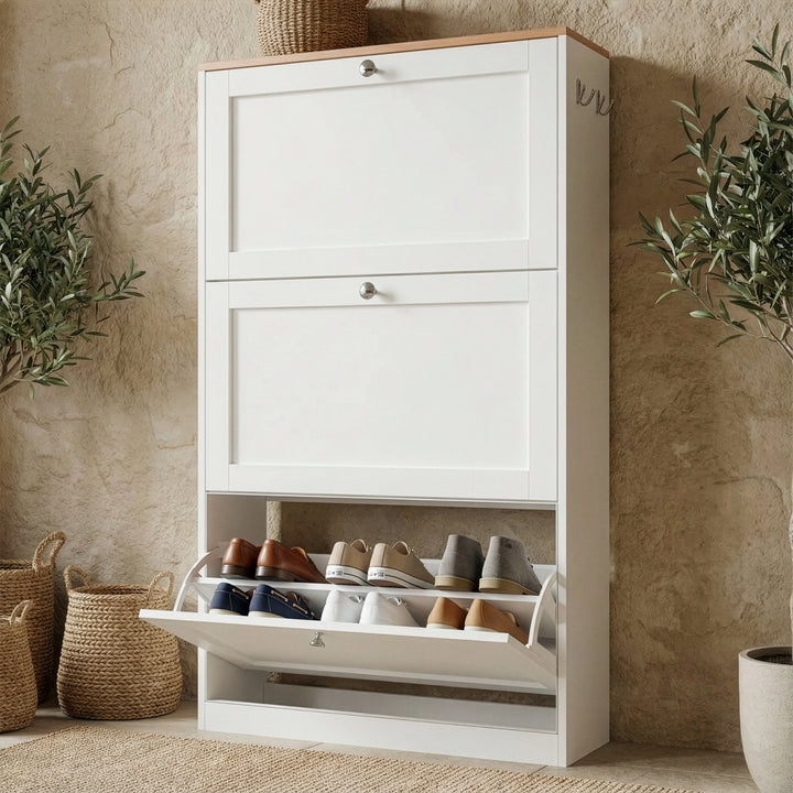 [White] White shaker shoe cabinet in hallway with slim profile and three storage compartments placed against a wall