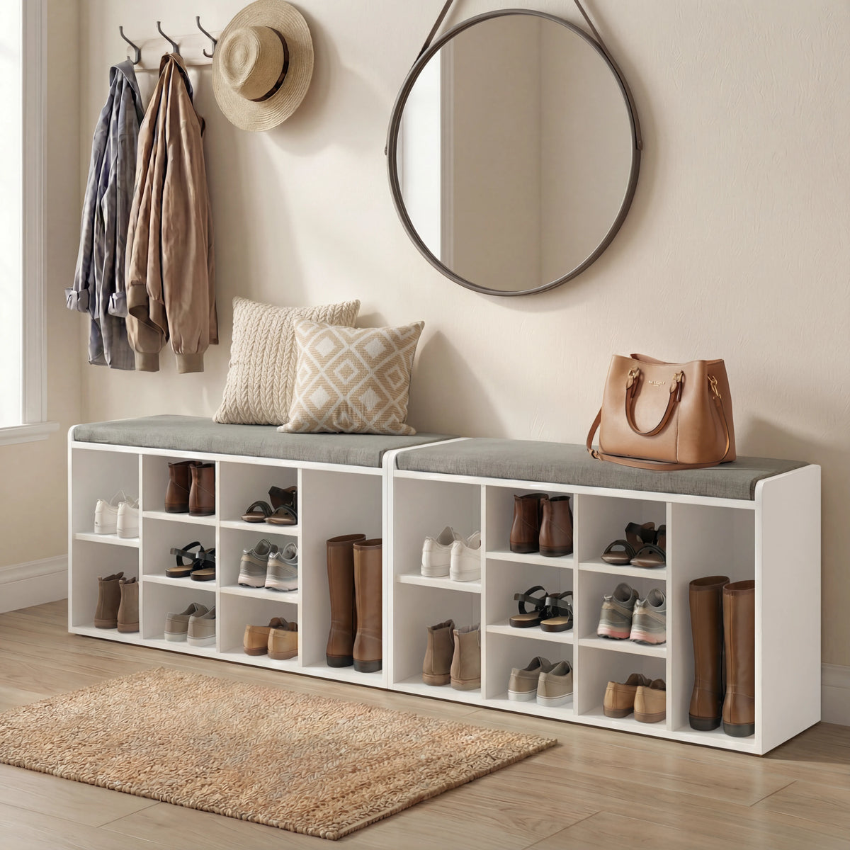 [White] Pair of shoe storage benches lining hallway wall with cushions, boots and shoes filling cubbies