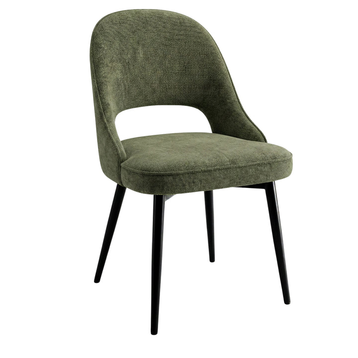[4 Seater | Green] Side-on Xylon green dining chair, curved backrest and black tapered foot in studio
