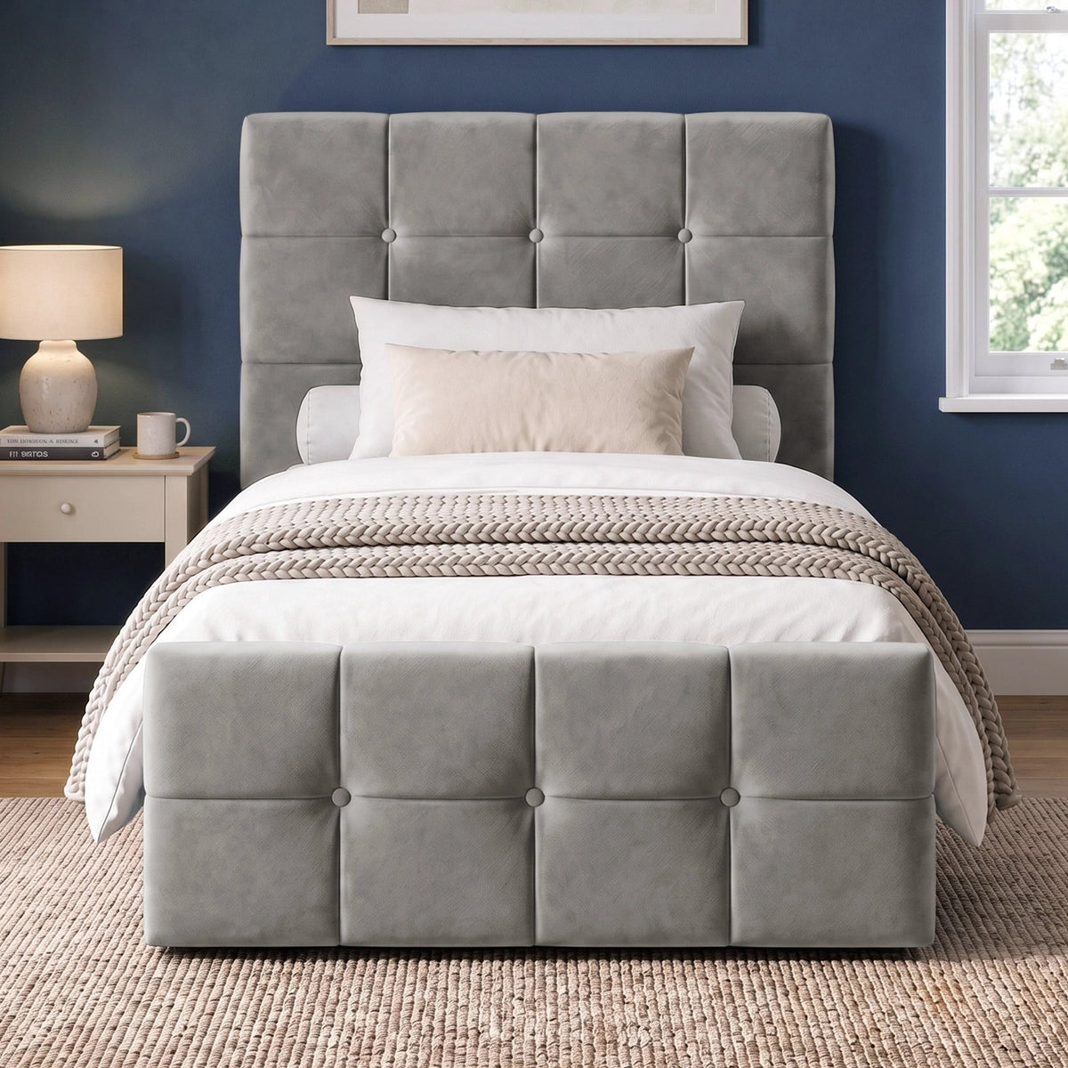 [Single | Grey] Straight front bedroom view with square panel headboard, padded footboard, knitted throw, lamp, and window