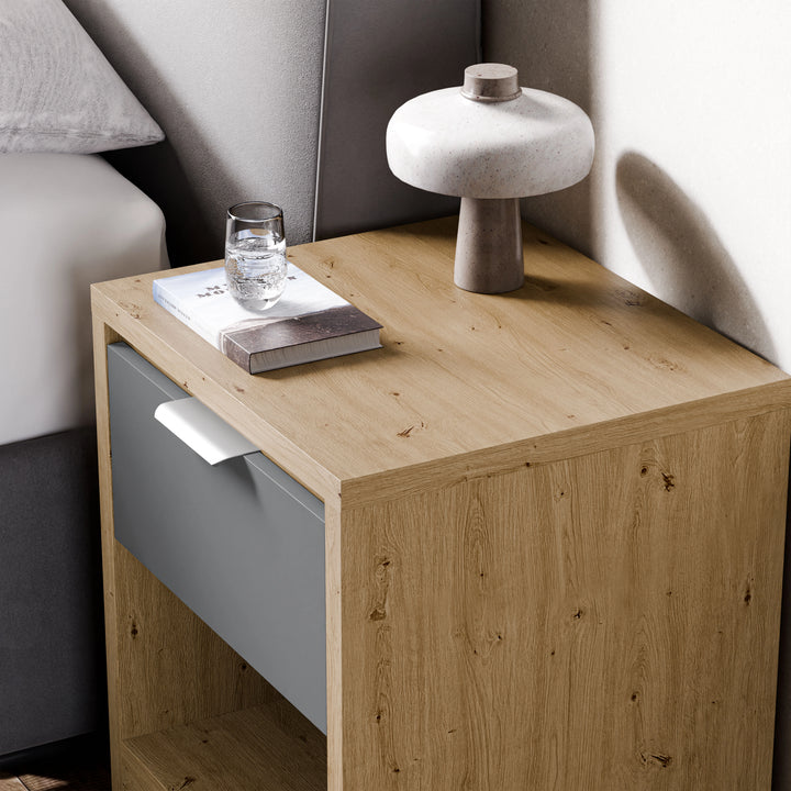[Oak+Grey] Oak and grey Skova bedside cabinet top corner, ceramic mushroom lamp glowing beside a folded magazine