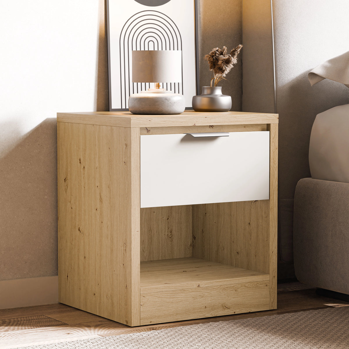 [Oak+White] Skova oak and white bedside shown beside upholstered bed and arch-print frame