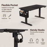 [160cm x 70cm] side fabric pocket on 160cm black standing desk holding pens and notebooks, hook below with headset