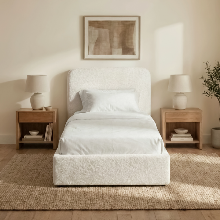 [White | Single] Sofna boucle ottoman bed front elevation, white boucle single frame centred between matching lamps