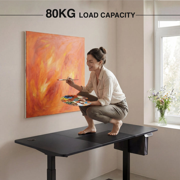 [120cm x 60cm] woman in beige crouching on 120cm black standing desk top painting orange canvas, 80KG load caption