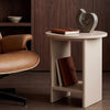 [Taupe] Small Round Side Table with Shelf Living Room beside tan leather armchair with sculptural object and journal on top and book stored on lower shelf