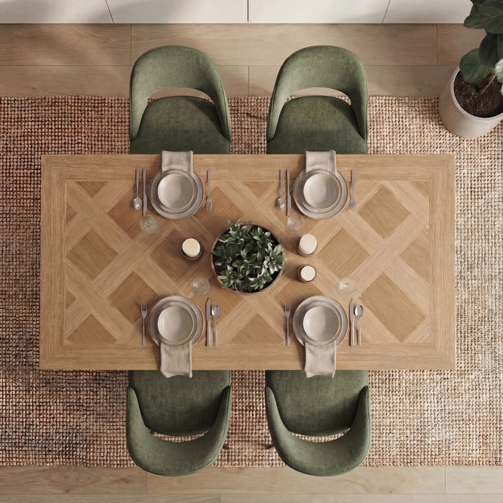 [4 Seater | Green] Top-down view of Aldridge oak parquet table with 4 green scoop chairs and green plant centerpiece.