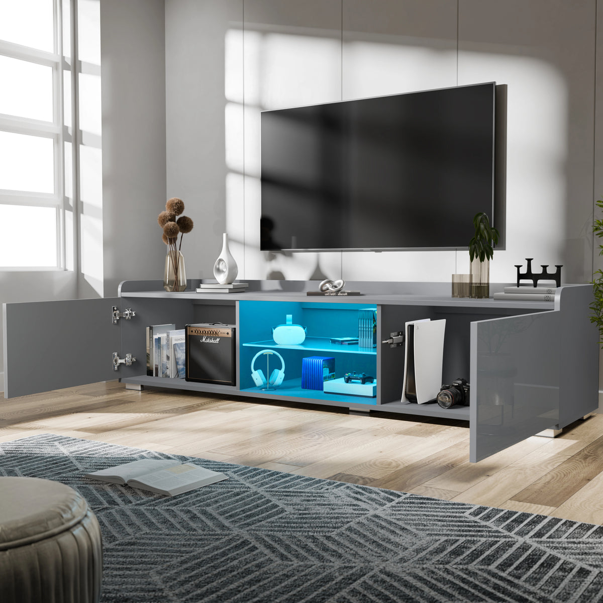 [Grey] Angled view of grey gloss TV unit, window left, TV mounted on white wall, blue LED shelves