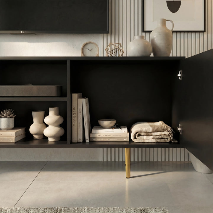 [Black]  Interior of black Flutrina TV unit with both ribbed doors open showing books, ceramic vases and folded textiles