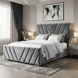 [Double | Dark Grey] Wide angle of velvet ottoman bed with chevron-stitched panels in styled bedroom with nightstands