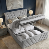 [Double | Grey] Gas-lift mechanism raising mattress platform showing full-length under-bed storage in velvet frame
