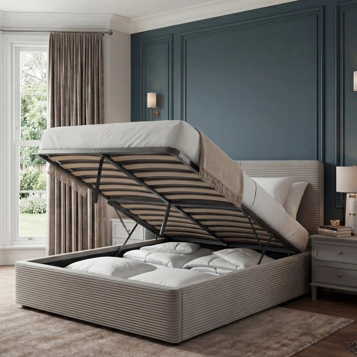 [King | Light Grey] Open king velvet ottoman bed in pale grey, mattress tilted up to reveal the storage cavity