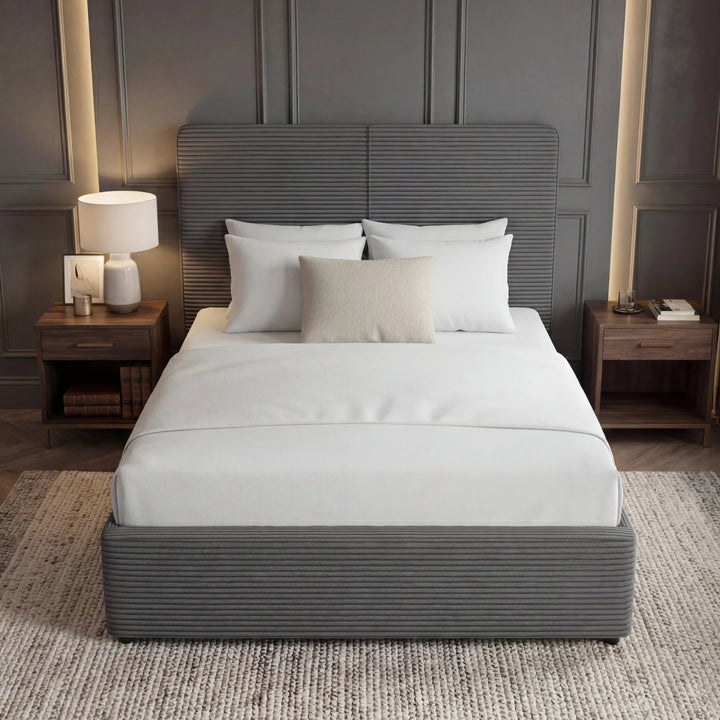[Single | Grey] Dark grey velvet ottoman bed in a single size, shot straight on with a side table and lamp beside