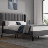 [Double | Grey] Upholstered bed from the side showing fluted headboard profile and styled neutral bedding