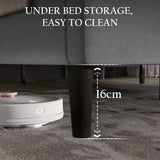 [King | Light Grey] Low-angle showing space underneath velvet bed frame with tapered dark legs for vacuum access