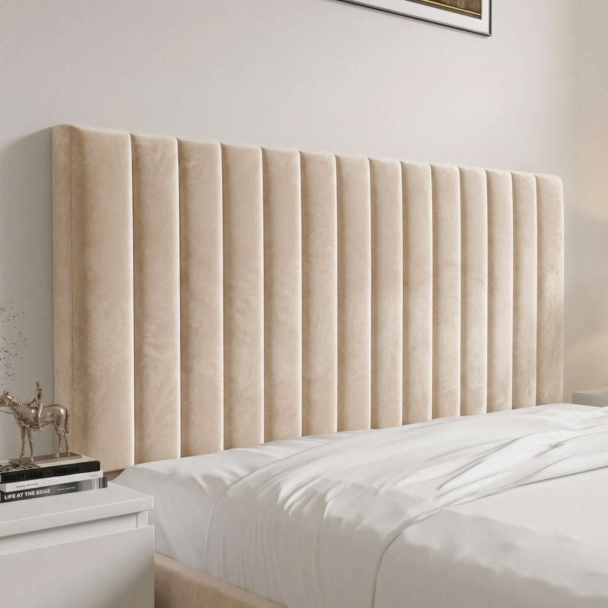[Beige | King] Detail view of king fluted bed headboard with deep vertical channels in soft velvet beside nightstand
