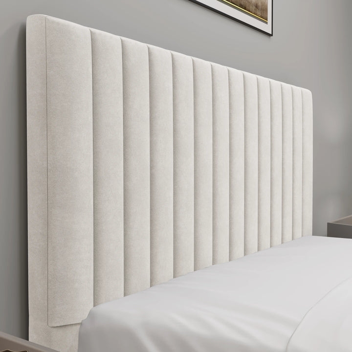[Beige | Small Double]Detail view of fluted bed frame headboard with deep vertical channels beside white bedside table