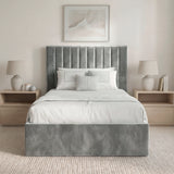 [Grey | Single] Front view of vertical channel bed frame with headboard flanked by wooden nightstands and ceramic lamps