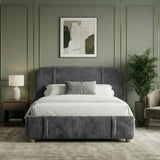 [King | Dark Grey] upholstered fabric bed frame from the front with walnut nightstand and potted palm beside shag rug