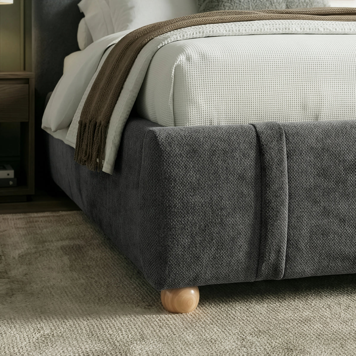 [Double | Dark Grey] Lower foot-end detail with upholstered corner and brown fringed throw draped above