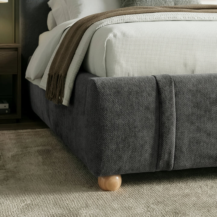 [Double | Dark Grey] Lower foot-end detail with upholstered corner and brown fringed throw draped above