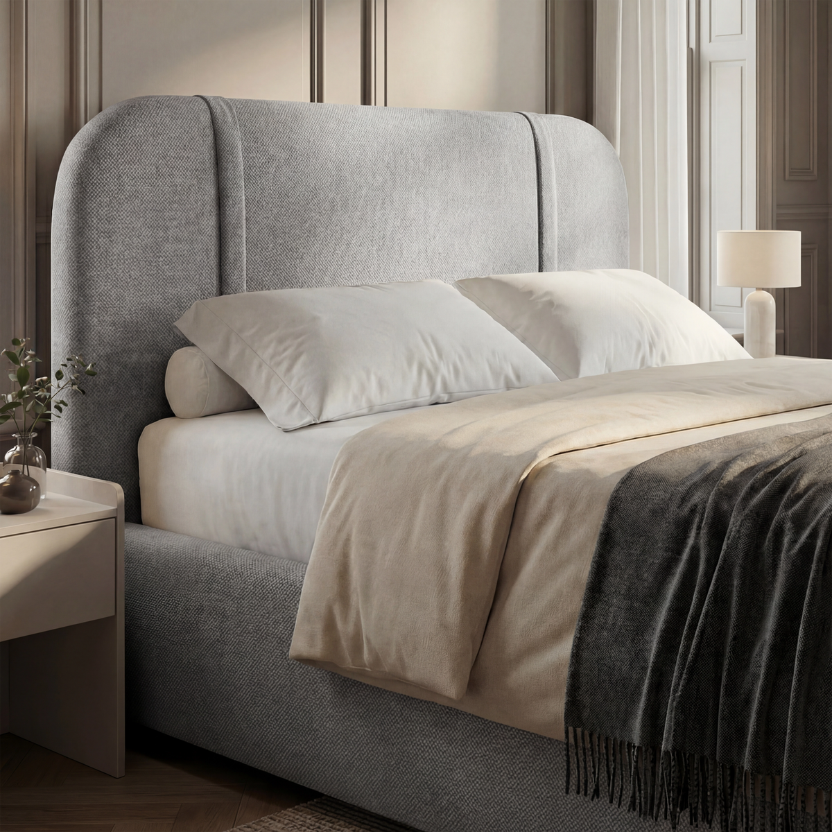 [Double | Grey] Three-quarter view of curved wingback headboard with layered white and charcoal bedding