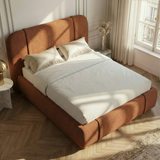 [Double | Orange] Above-angle perspective of wingback bed with marble table and brass lamp in Parisian room