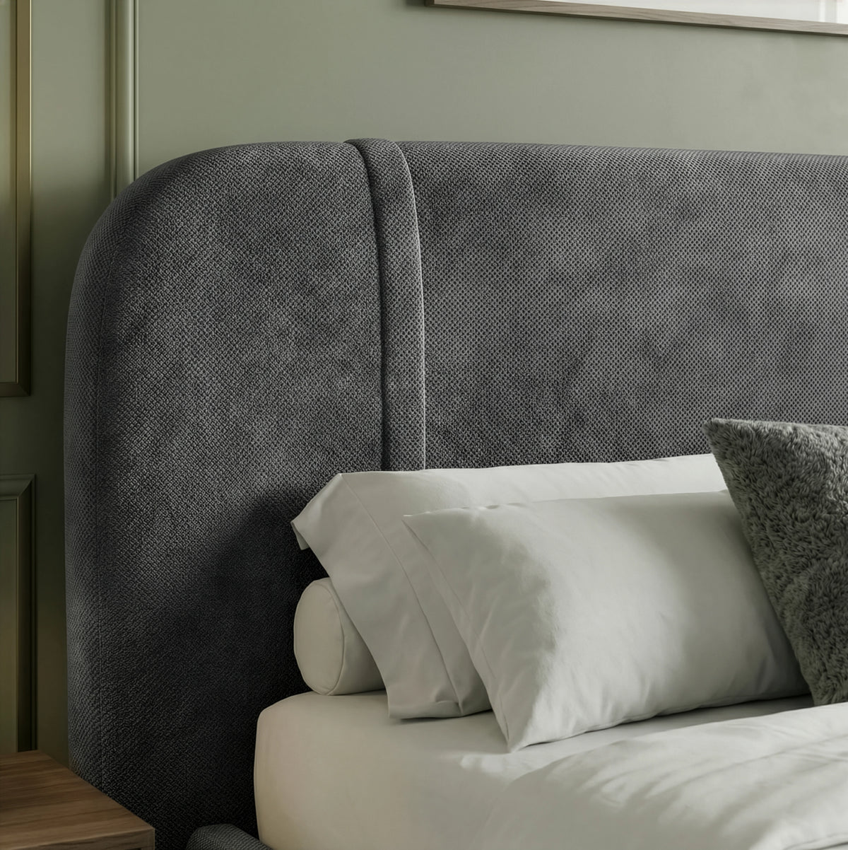 [King | Dark Grey] Close-up of curved headboard showing textured fabric and vertical channel stitch against sage wall