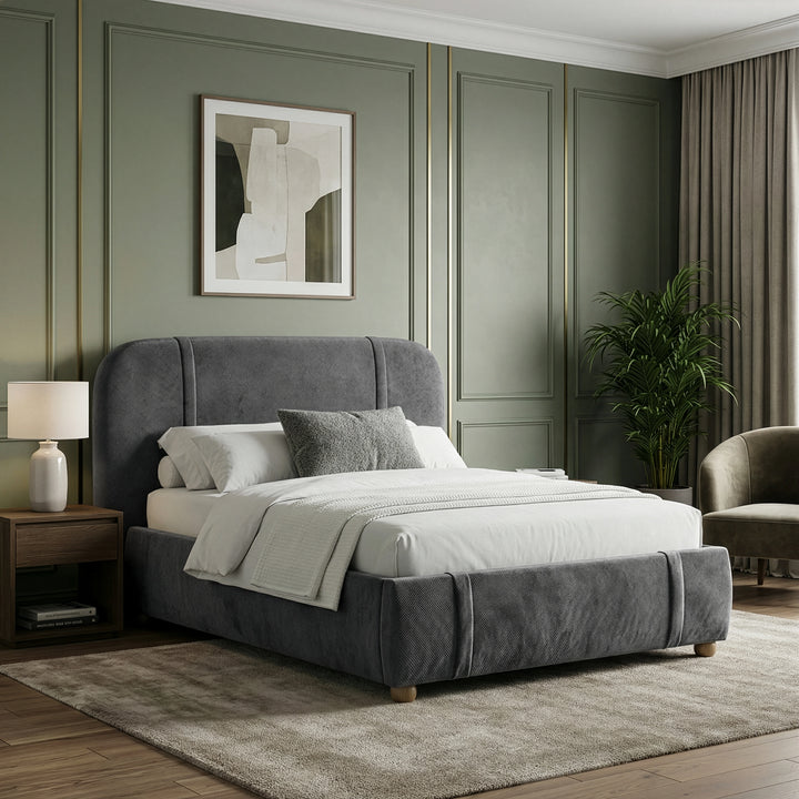 [King | Dark Grey] Upholstered bed from the side with abstract art above and walnut nightstand with ceramic lamp
