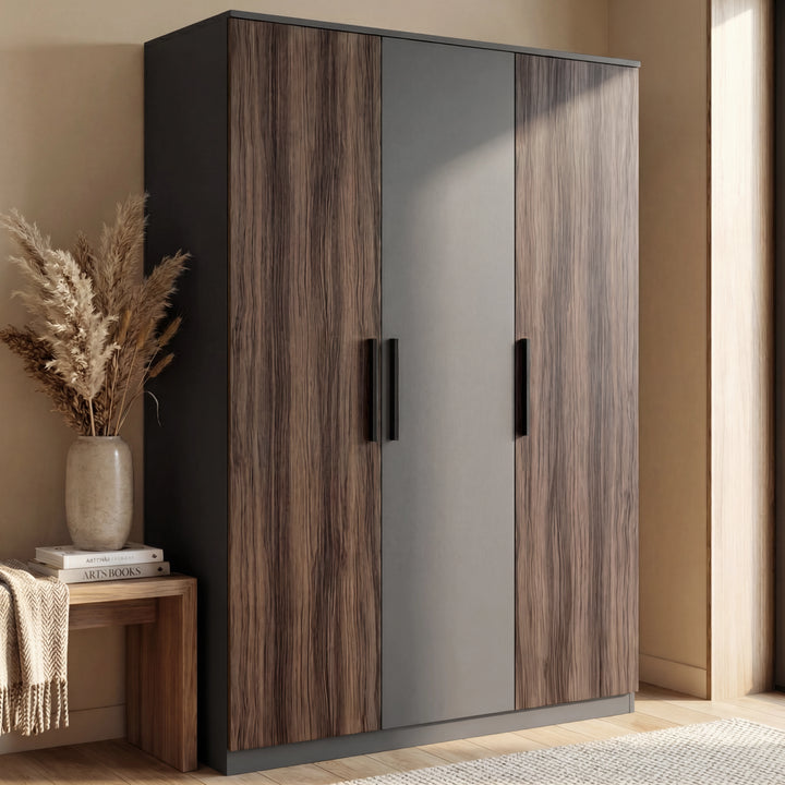 [Walnut] Three door walnut and grey wardrobe with contrasting panels and black vertical handles in room setting