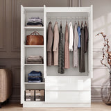 [White] Opened 3 door wardrobe showing left shelving section with storage boxes and right hanging rail with clothes