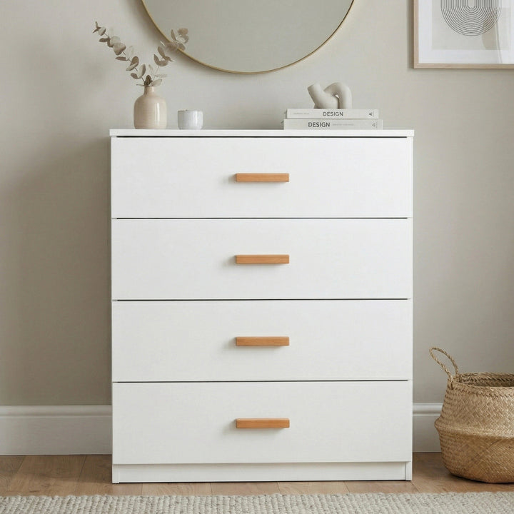 [White] Front facing view of white four drawer chest with flat drawer fronts and wooden bar handles