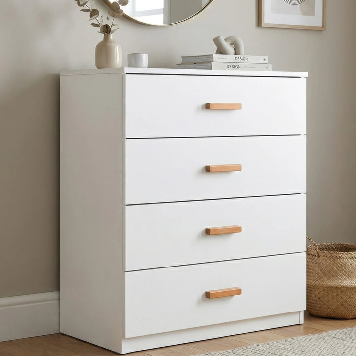 [White] four drawer chest placed in room setting with neutral decor and smooth painted finish