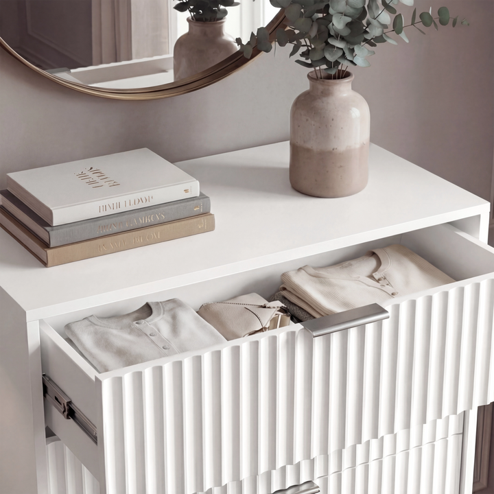 [White] Close detail of white flutrina drawer front with silver metal handle and vertical textured panel design