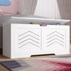 [White] White arrow design storage chest with lid raised showing soft toys, set against pink cloud wallpaper