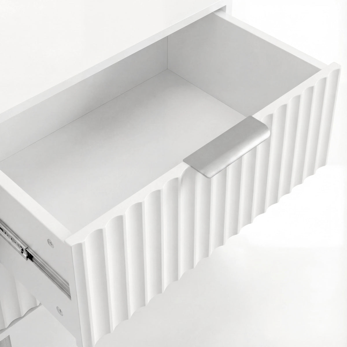 [White] Interior view of white bedside drawer with smooth painted finish and practical storage depth