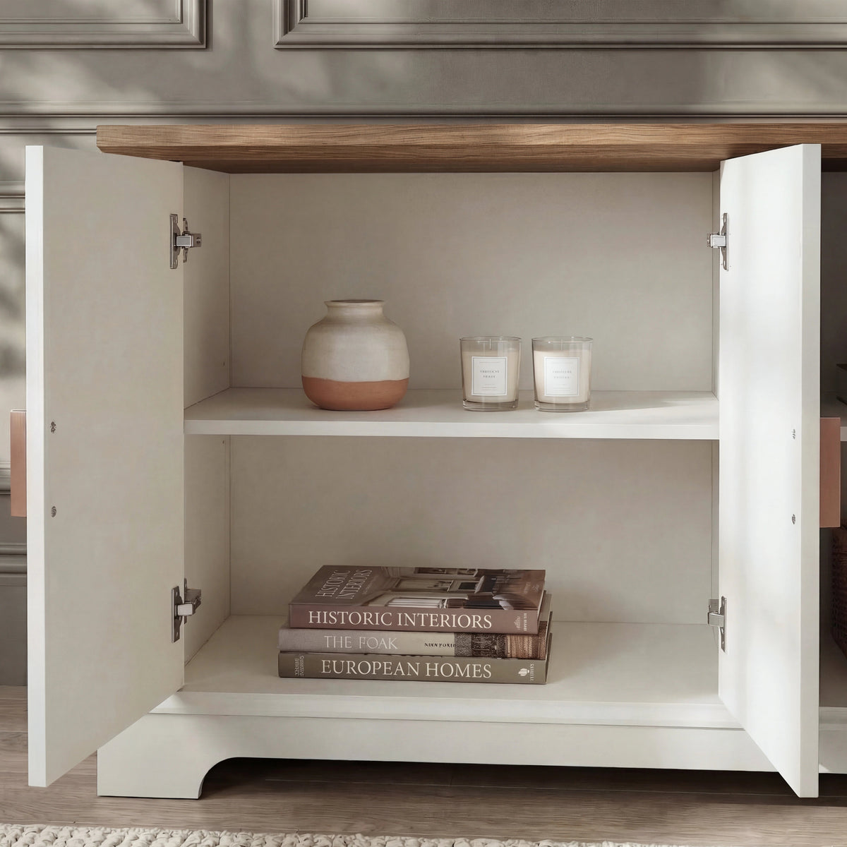 [White | 170cm] Bellford left cupboard interior with ceramic vase and candles on the upper shelf and books below